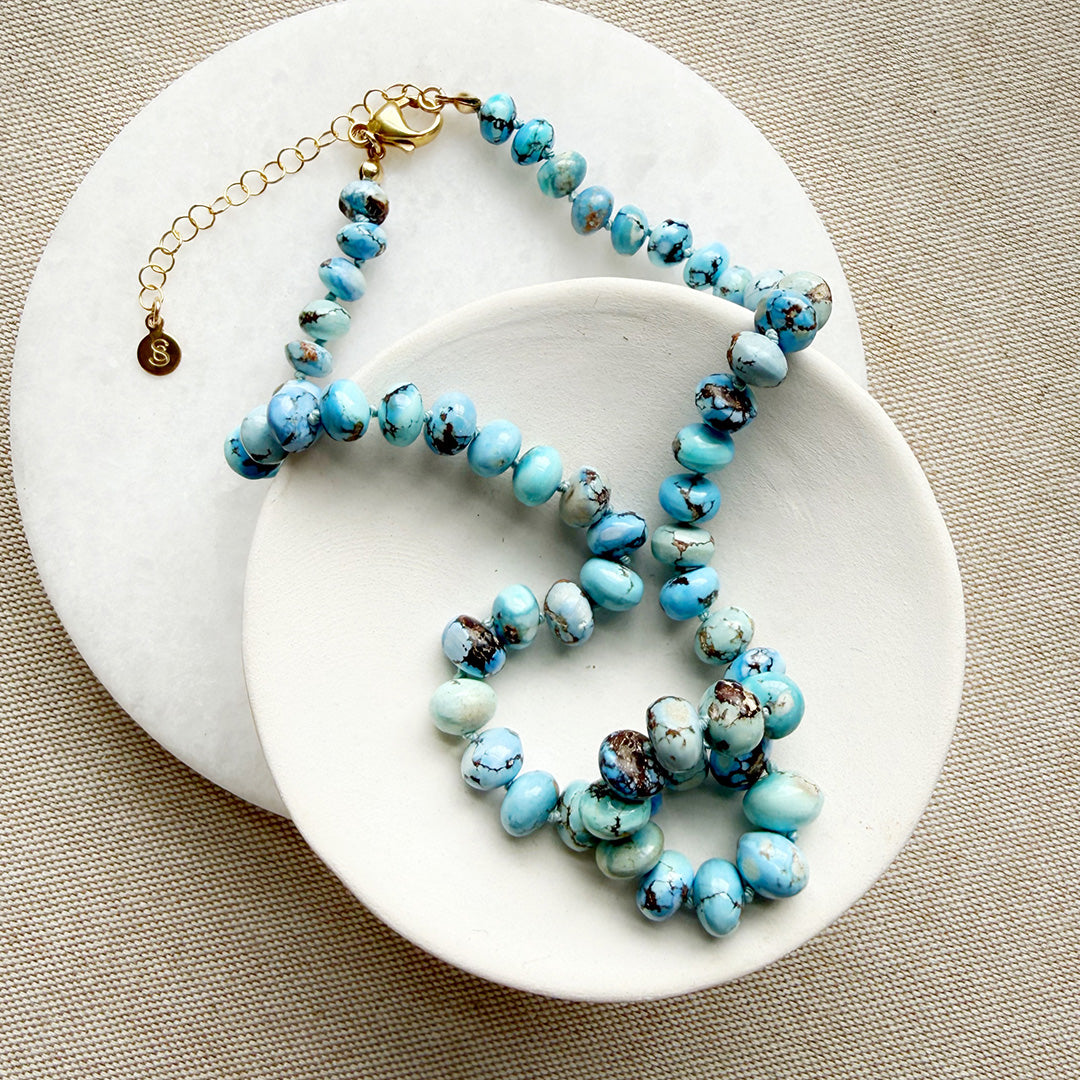 Golden Hills Turquoise knotted necklace in a white dish
