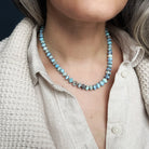 Close up of woman wearing Golden Hills turquoise knotted necklace