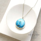 Golden Hills Pendant set in sterling silver in a white dish