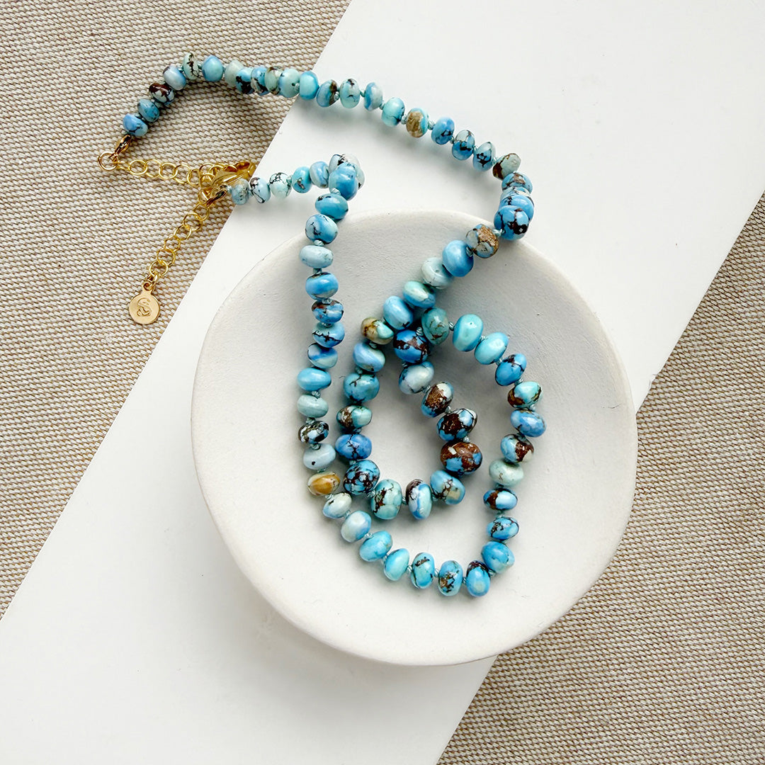 Golden Hills Turquoise knotted necklace in a white dish