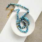 Golden Hills Turquoise knotted necklace in a white dish