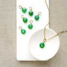 Round green chrysoprase charm with inset cz stone