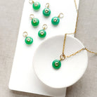 Round green chrysoprase charm with inset cz stone