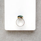 Green Tourmaline mixed metal ring on a white background