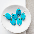 Oval blue howlite charm with inset quartz stone