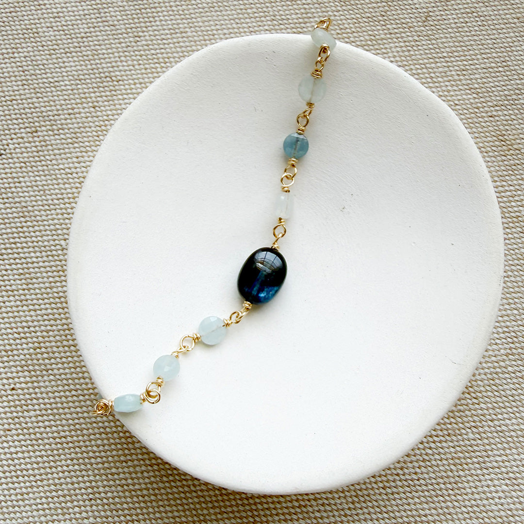 Kyanite and aquamarine bracelet in a white dish