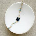 Kyanite and aquamarine bracelet in a white dish