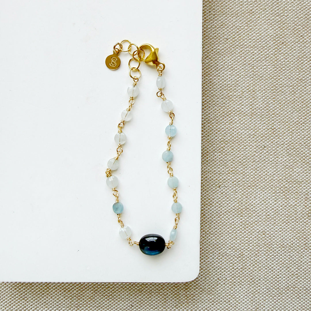 Kyanite and aquamarine bracelet on a white dish