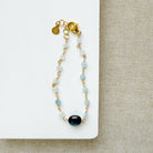 Kyanite and aquamarine bracelet on a white dish