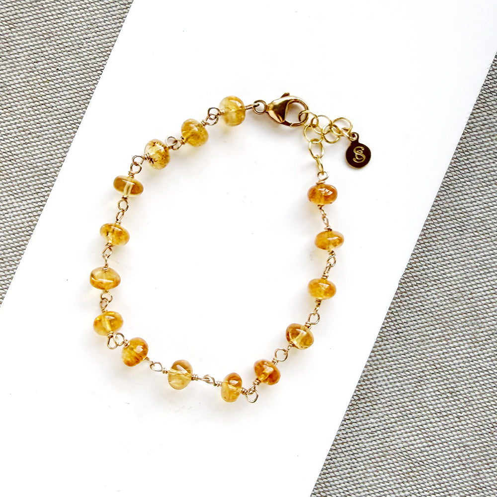 Imperial topaz bracelet on white plate