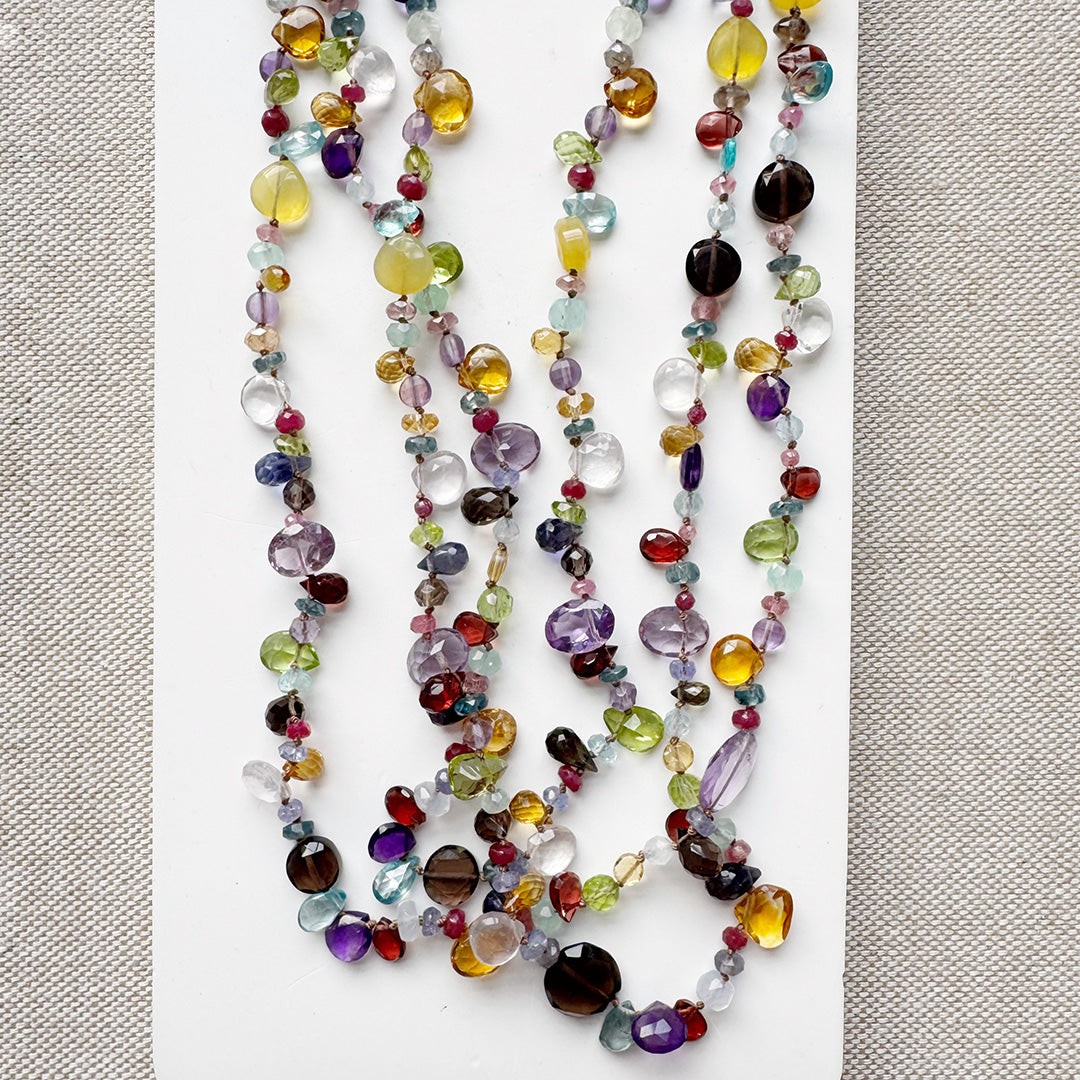 Colorful gemstone necklace on a light background