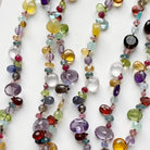 Close up of colorful gemstone necklace on a white background