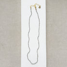 Necklace with small labradorite gemstones on a white background