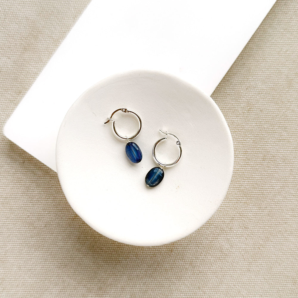 Silver hoop earrings with blue kyanite gemstone drop