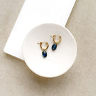 Gold hoop earrings with blue kyanite gemstone drop