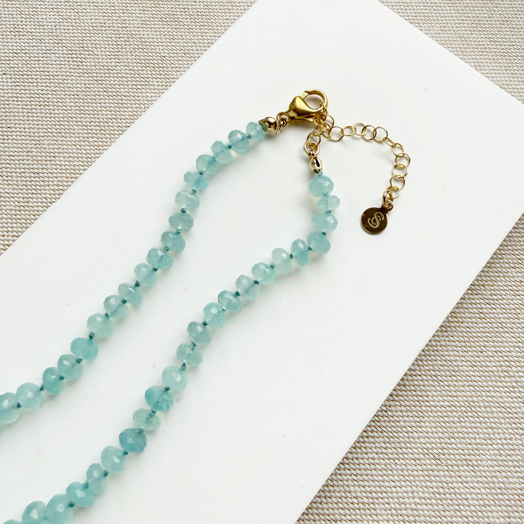 Clasp detail of knotted chalcedony gemstone necklace