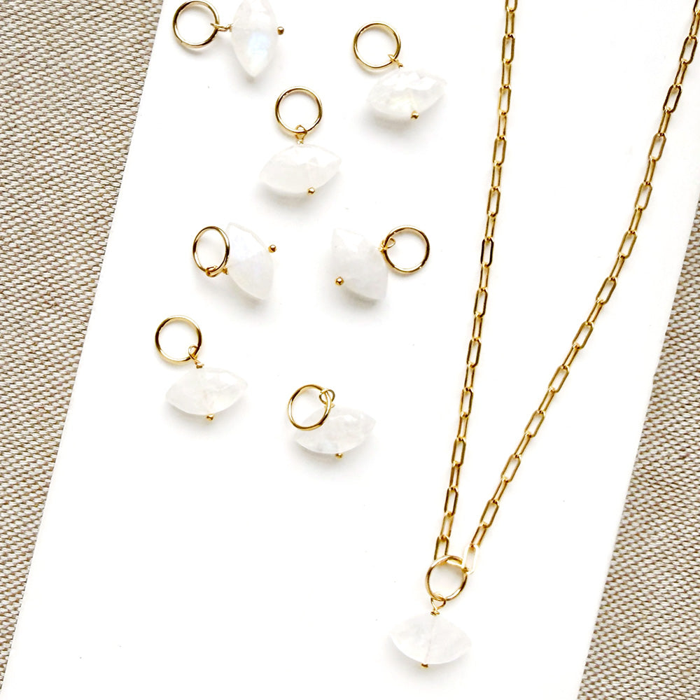 Marquis cut white moonstone charm on a white background