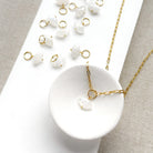 Marquis cut white moonstone charm on a white background