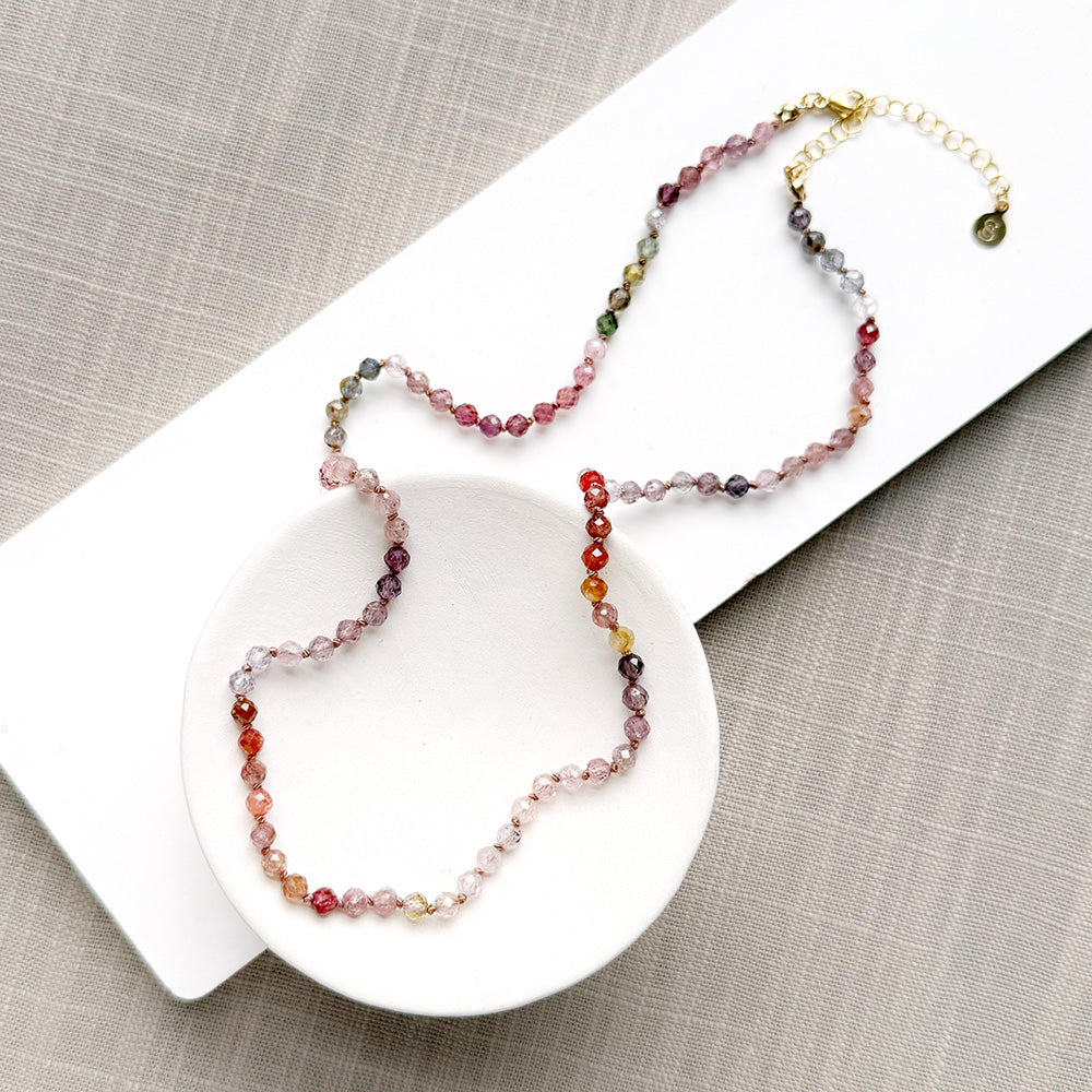 Spinel knotted necklace in a white dish