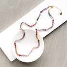 Spinel knotted necklace in a white dish