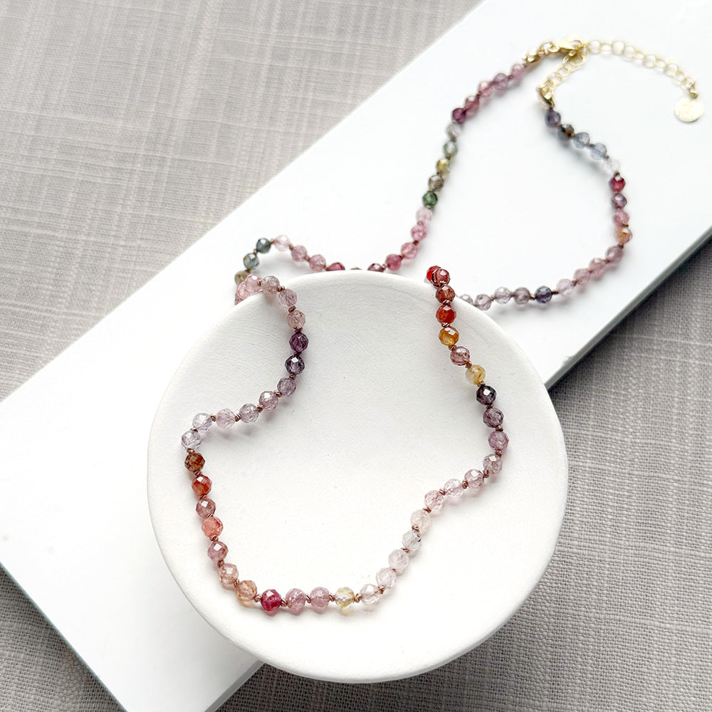 Spinel knotted necklace in a white dish