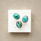 Nevada turquoise rings on a white card numbered 1 through 3.