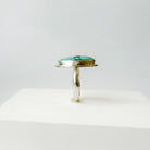 Side view of Nevada turquoise ring on a white background