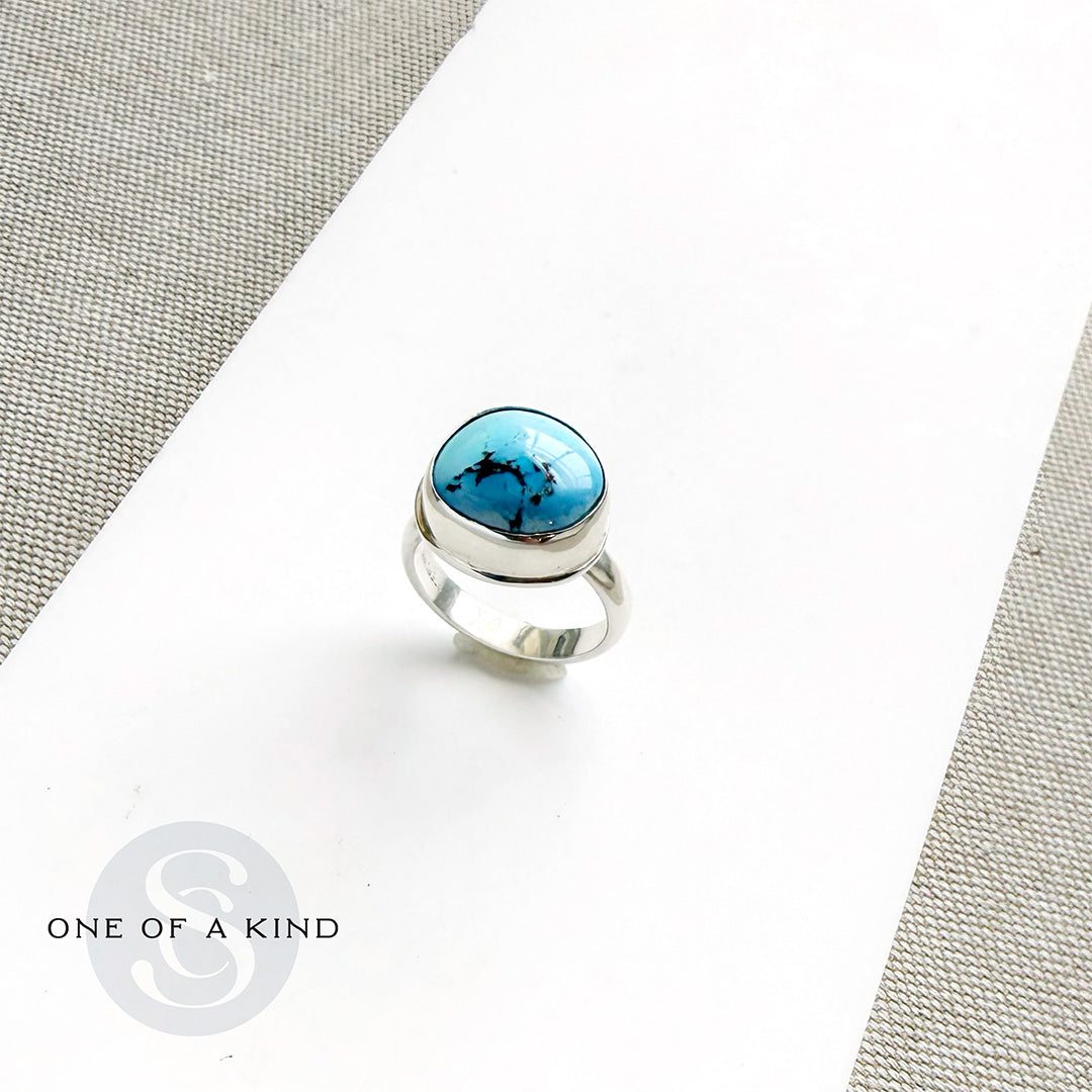 One of a kind Golden Hills Turquoise silver ring on a white background