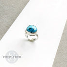 One of a kind Golden Hills Turquoise silver ring on a white background