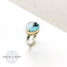 One of a kind Golden Hills turquoise mixed metal ring on a white background