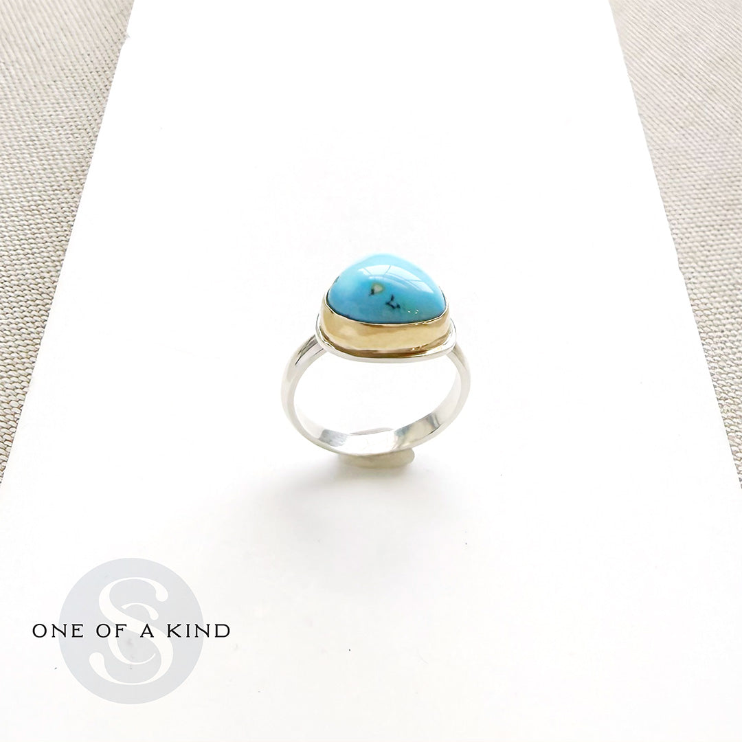 One of a kind Golden Hills turquoise mixed metal ring on a white background