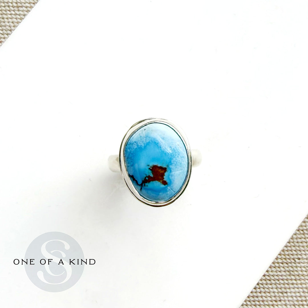 One of a kind Golden Hills Turquoise silver ring on a white background