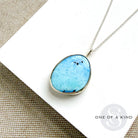 Golden Hills Turquoise pendant necklace on a white card with 'One of a Kind' branding.