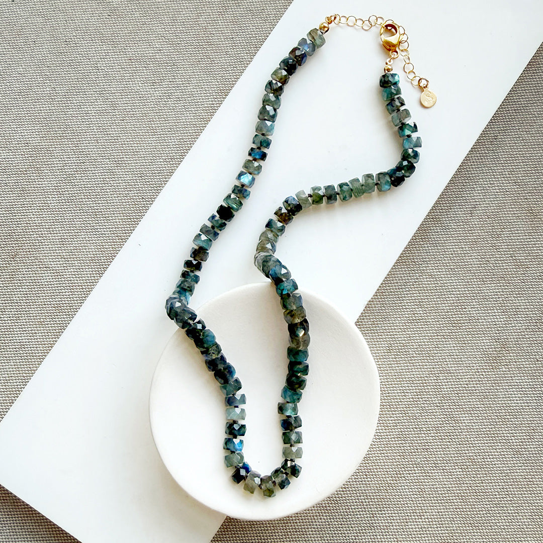Knotted Labradorite necklace in a white dish