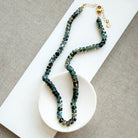 Knotted Labradorite necklace in a white dish