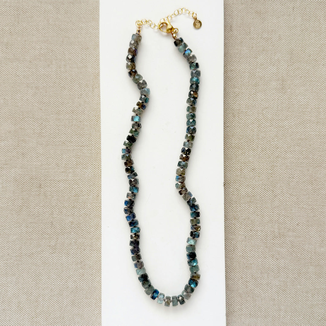 Knotted Labradorite necklace on a white plate