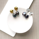 Peacock pearl earrings with a gold and silver disc
