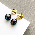 Peacock pearl earrings with a gold disc