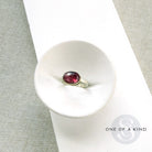 Pink tourmaline mixed metal ring in a dish