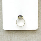 Pink tourmaline mixed metal ring on a white background
