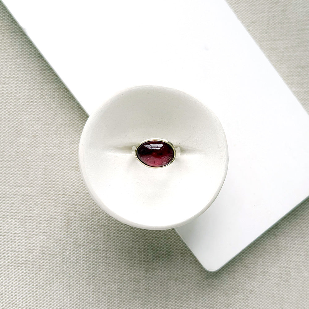 Pink Tourmaline Mixed Metal ring in a dish