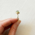 Side view of a green prehnite gemstone ring.