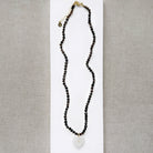 Smoky quartz knotted necklace with heart shaped carved pendant