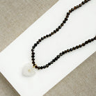 Smoky quartz knotted necklace with heart shaped carved pendant