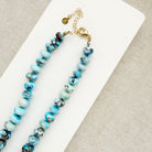 Golden Hill turquoise beaded necklace on a white dish with a neutral background 