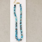Golden Hill turquoise beaded necklace on a white dish with a neutral background 
