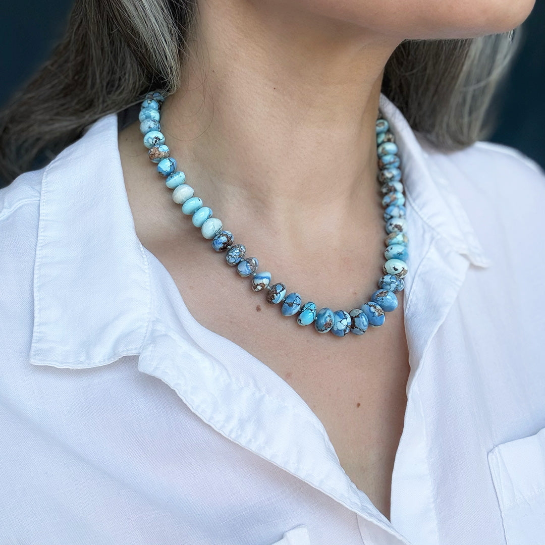 Golden Hills turquoise beaded necklace worn by a person with a white shirt
