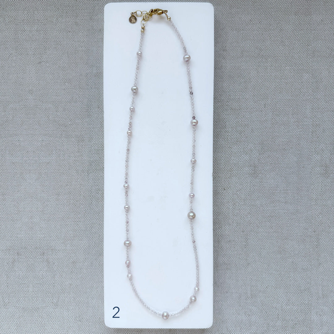 Option 2 Rose quartz and pearl necklace on a white card with a gray background