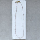Option 2 Rose quartz and pearl necklace on a white card with a gray background