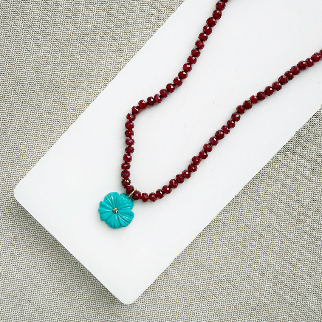 Ruby knotted necklace with turquoise carved flower pendant